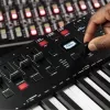M-Audio Oxygen Pro 49 MIDI klaviatūros valdiklis — 49 klavišai, 16 padeliai, 9 šleifiniai reguliatoriai, OLED ekranas, USB, MIDI išėjimas