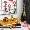 Kuprinės draugų raktų pakabukų rinkinys Paladone Super Mario CDU 24 vnt. – įvairūs personažai, kolekcionuojami aksesuarai