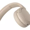 Sony WH-CH520 Belaidės ausinės ant galvos, skirtos skambučiams/muzikai, USB Type-C, Bluetooth, įkrovimo stovas, kreminė