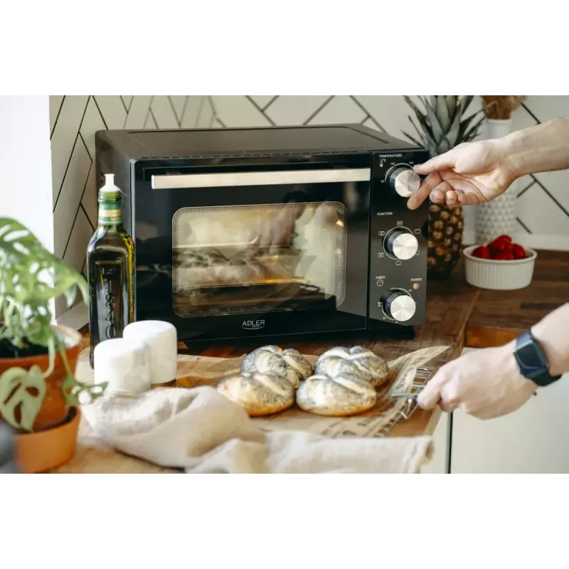 Elektrinė stalinė orkaitė Adler AD 6024 — kompaktiška 22 l talpa, 1300 W, juoda