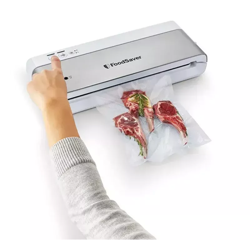 Vakuuminis sandariklis FoodSaver VS0100X — sukamoji rankenėlė, komplekte ritinėlis ir 4 vakuuminiai maišeliai, sidabrinės baltos spalvos