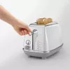 Skrudintuvas De’Longhi CTOC2103.W 2 riekėms 900 W baltas nerūdijantis plienas