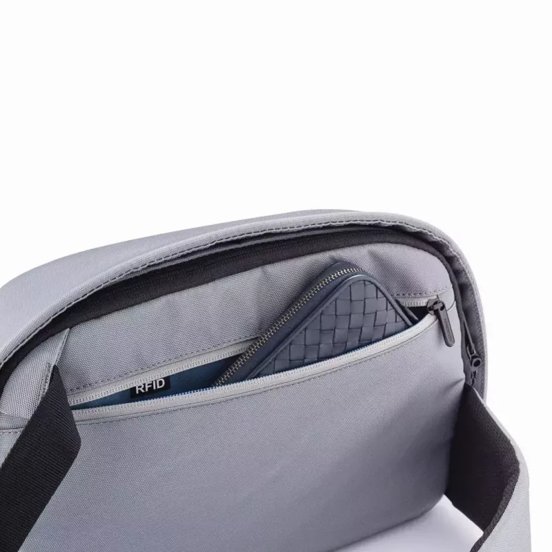 Apsaugotas nuo vagystės kuprinė XDDESIGN Bobby Sling pilka — lengva, atspari vandeniui, nešiojama per petį