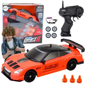 LEAN TOYS nuotoliniu valdymu sportinis automobilis 1:24 oranžinis su keičiamais ratais