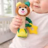 LEAN TOYS Minkštas meškiukas su barškučiu, dantukų kramtuku ir cyptuku kūdikiams