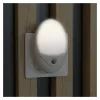 ENTAC LED naktinė lemputė 0,5W ovali šilta balta su prieblandos jutikliu
