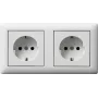 GIRA 479304 SCHUKO 2 vietų iš anksto sujungta kištukinė su rėmeliu, gryna balta