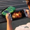 Hyperkin M07541-MTCN Kieto korpuso dėklas, žalias, įvairiaspalvis, PEVA, skirta Nintendo Switch Lite, atsparus smūgiams, vandeniui atsparus, nešiojimo krepšys