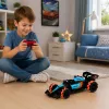 LEAN TOYS 1:14 4WD nuotolinio valdymo triukų automobilis su 360° sukimu ir LED lemputėmis