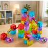 LEAN TOYS Magnetiniai statybiniai blokeliai 60 vnt. – Spalvingas kubelių ir rutuliukų takelio konstravimo rinkinys