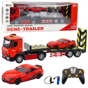LEAN TOYS Nuotolinio valdymo automobilių transporterio rinkinys 1:16 – RC vilkikas ir raudonas sportinis automobilis (22707)