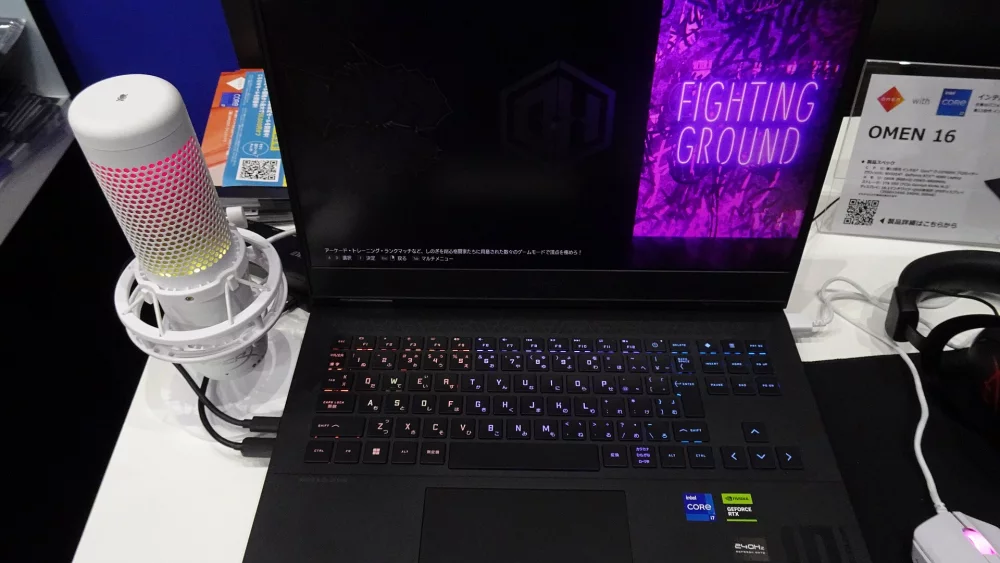 Laptops on display with product information cards
